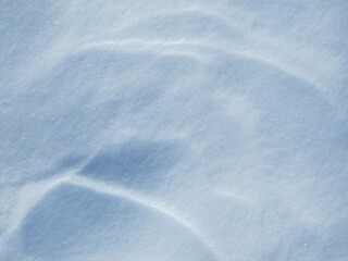 Fototapeta premium Shadows and patterns on the surface of snow