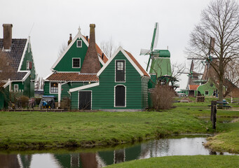 Europe, Netherlands, Zaanse Schans. Village houses and windmills.