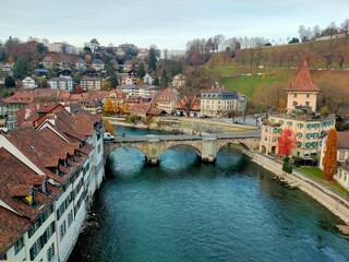 ancient city with a bridge and a river flowing through the city