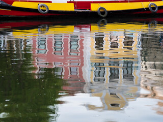 Portugal, Aveiro. Moliceiro boats along the main canal of Aveiro