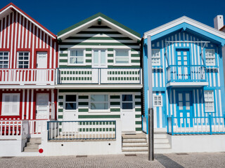 Portugal, Costa Nova. Colorful houses Palheiros striped homes