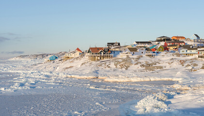 Winter in Ilulissat on the shore of Disko Bay. Greenland, Denmark