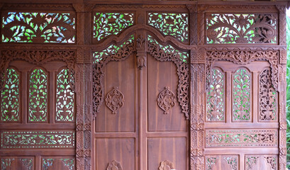 Gebyok in Javanese traditional houses is a teak wood plank that functions as a wall or insulation...