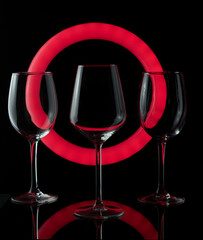 glass of wine. Set of empty crystal wine glasses, with black background and transparent tones.
