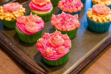Homemade cupcakes with decorative frosting.