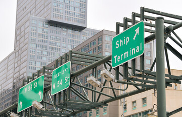 New York, USA - 2021: Traffic signs indicating the way to the Ship Terminal from Manhattan.
