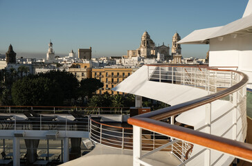 View from outdoor pool sun deck of luxury cruiseship cruise ship liner with railing and...
