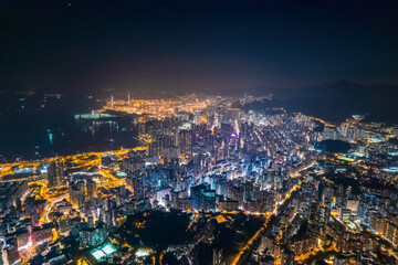 Fototapeta na wymiar cyberpunk mood of the aerial night cityscape, Kowloon, Hong Kong