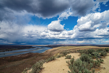 Fototapeta na wymiar Storm clouds hover over the Columbia River in the Saddle Mountain National Wildlife Refuge in Washington, USA