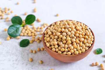 soybean or soya bean in wooden bowl on white table background.