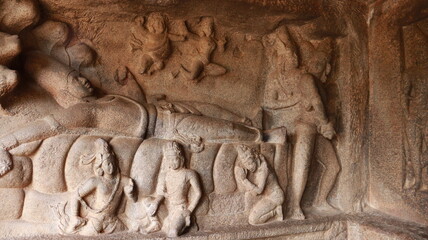 Mahishasuramartini Cave Temple. Sculptures carved in rock. Rock background