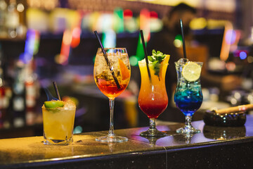 Cocktails set on a bar at Casino. Cocktails assortment.