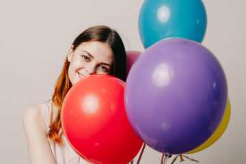 Obraz premium cheerful woman in a dress of colorful balloons