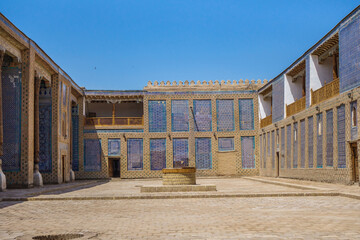 Harem courtyard in Tash Hauli palace, Khiva, Uzbekistan. Walls are decorated with traditional...