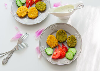 Chickpea cutlets on gray plate.