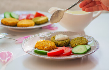 Chickpea cutlets on gray plate.