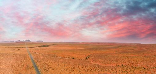 Road to the Monument Valley, aerial view from drone at sunset