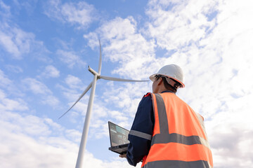 Engineer walk to check wind power plants with check performance. Wind turbines are an alternative electricity source to be sustainable resources in the future. Clean energy concept saves the world
