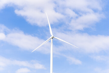 Wind turbines of global ecology with cloud background on the sky. alternative electricity source to be sustainable resources in the future. Clean energy concept saves the world