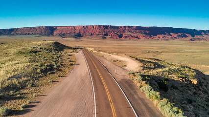 Naklejka premium Aerial view of beautiful road corssing the canyon in summer season