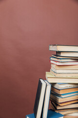 lots of books to study in the university library on a brown background