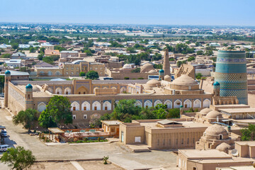 Historical buildings of Khiva (Uzbekistan) from above. In the center you can see the madrasah of...