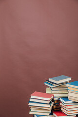 lots of books to study in the university library on a brown background