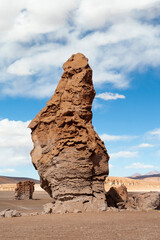 Chile, Atacama Desert, Los Flamencos National Reserve. Eroded volcanic structures called the Pacana Guardians dot the landscape.
