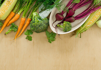 Raw ingredients for cooking vegetarian food on wooden table. Healthy vegan meal top view