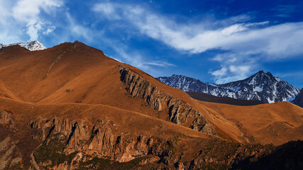 Landscape of majestic scenic snowy brown mountains ridge in Georgia country