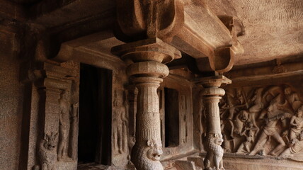 Mahishasuramartini Cave Temple. The pillar carved in the rock is located in the background of the cave temple