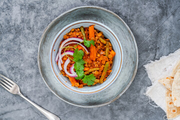 Vegan green lentil curry with paratha flatbread
