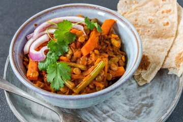 Vegan green lentil curry with paratha flatbread