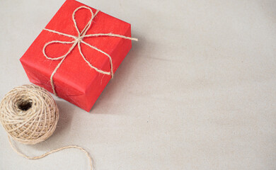 Eco friendly Christmas composition with gift boxes in craft reusable paper and natural decor on...