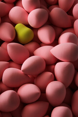 beauty background a bunch of pink gentle sponges and one contrast green conflict for makeup vertical orientation dark key