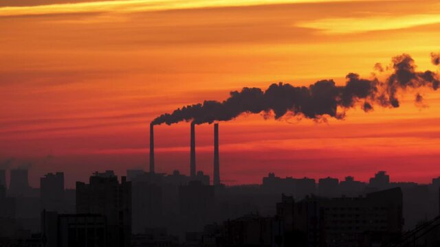 Pollution Of The City With Smoke From Pipes Against Of A Scarlet Sunset