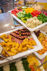fish slicing on the buffet in the restaurant