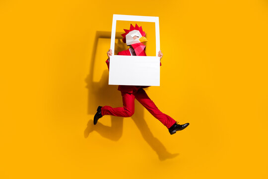Profile photo of guy jump hold snapshot frame sporty run wear cock polygonal mask red tux isolated yellow color background
