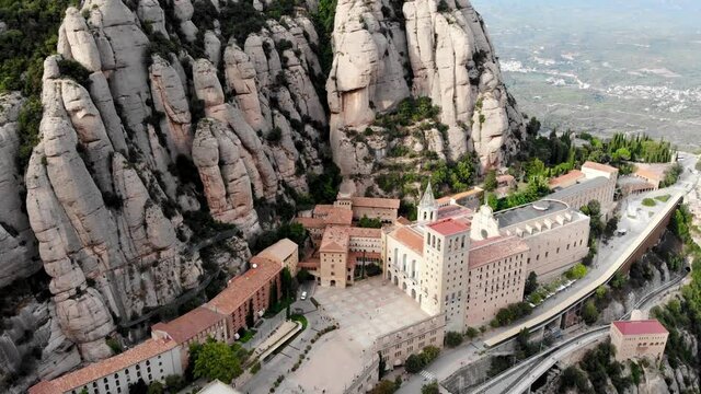Drone shot of Mount Montserrat. Drone view of the famous Montserrat monastery.
Mountain shelter of Benedictine monks. The jagged mountains of Spain. Mountain landscape. Mountain trails.