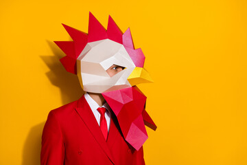Profile photo of successful anonymous guy wear rooster polygonal mask red suit isolated yellow color background © deagreez