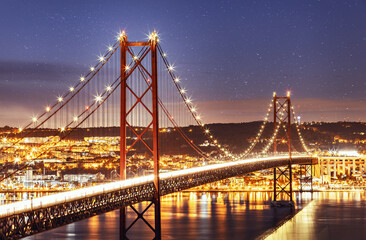 night bridge on April 25 in Portugal. Lisbon. fantastic night landscape with starry sky
