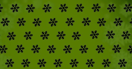 Digitally generated image of snowflakes pattern with copy space on green background