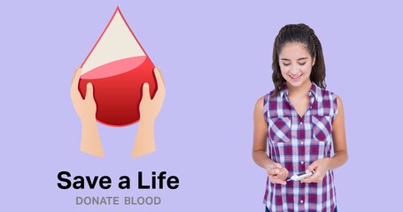 Smiling young woman using equipment by save a life donate blood symbol