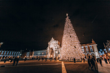 night new year city. a large Christmas tree illuminating a shopping area in Lisbon