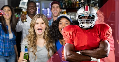 Digital composite image of american football player with arms crossed against excited fans