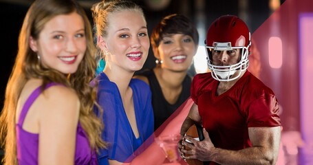Portrait of smiling female fans at sports bar watching american football player holding ball