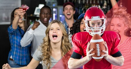 Obraz premium Portrait of confident american football player holding ball with happy fans shouting