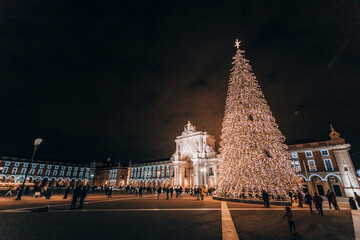night new year city. a large Christmas tree illuminating a shopping area in Lisbon