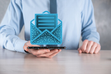 Businessman hand holding letter icon,email icons.Contact us by newsletter email and protect your...
