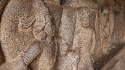 Fototapeta na wymiar Mahishasuramartini Cave Temple. Idols carved in rock are Hindu gods. The rock is located in the background